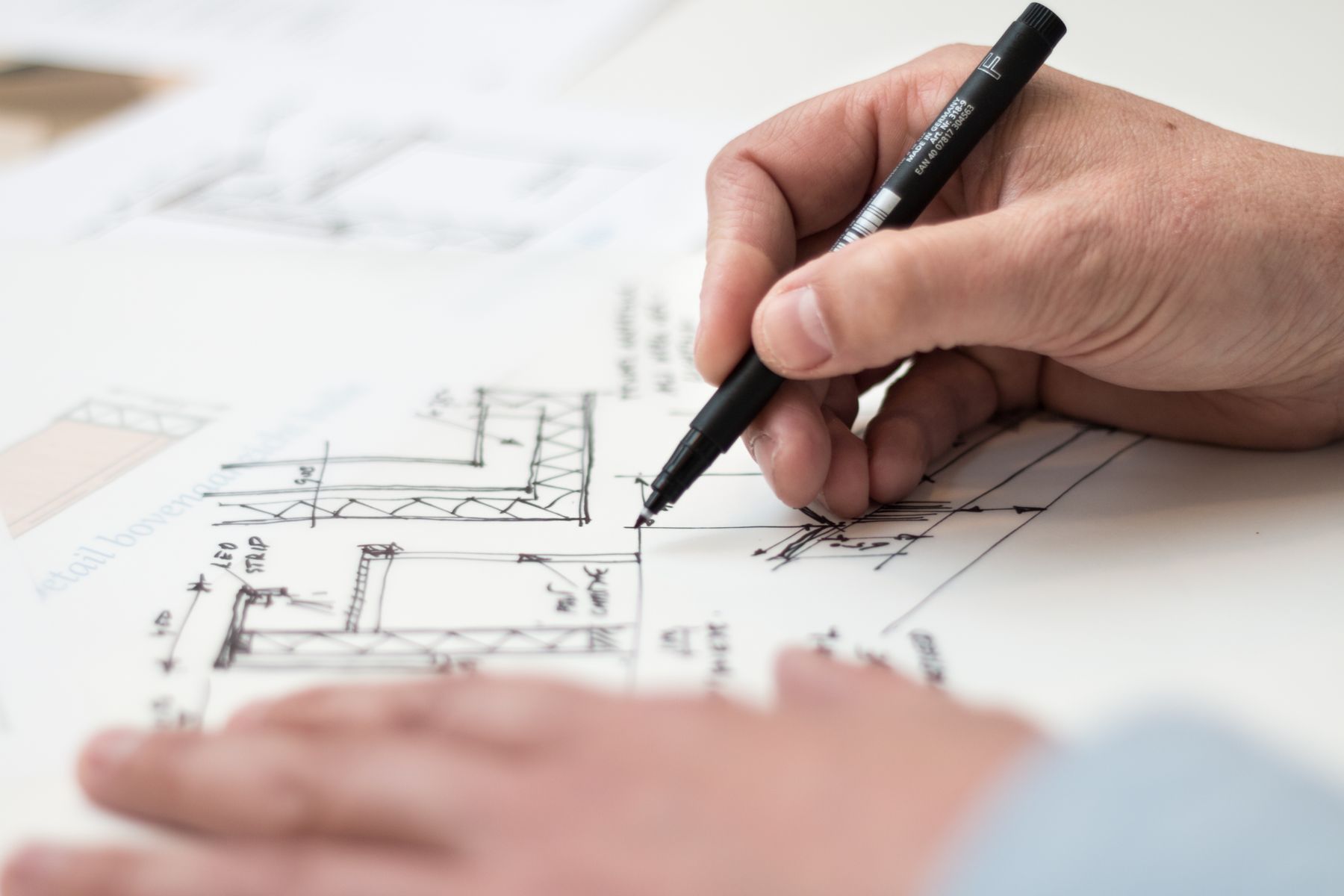 Architect reviewing blueprints